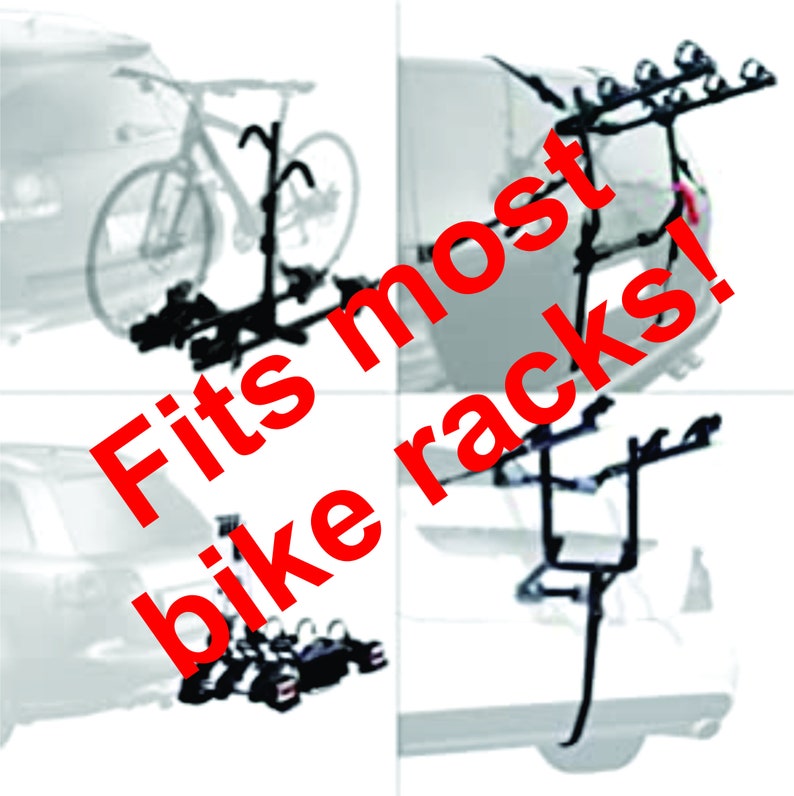 May include: A black bike rack attached to the back of a car. The rack is designed to hold two bikes. The text "Fits most bike racks!" is superimposed on the image.