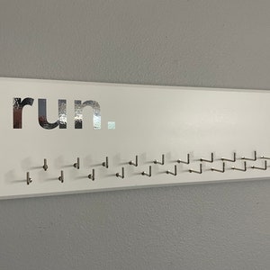 Running Medal Holder, white, gray or black with chrome &quot;run.&quot; vinyl and 21 hooks.