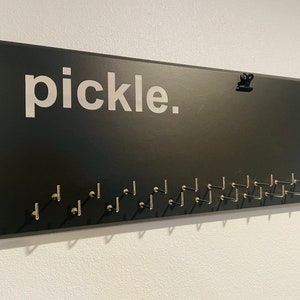 Medal Holder for pickleball gray or black with &quot;pickle.&quot; vinyl, 21 hooks and BIB holder