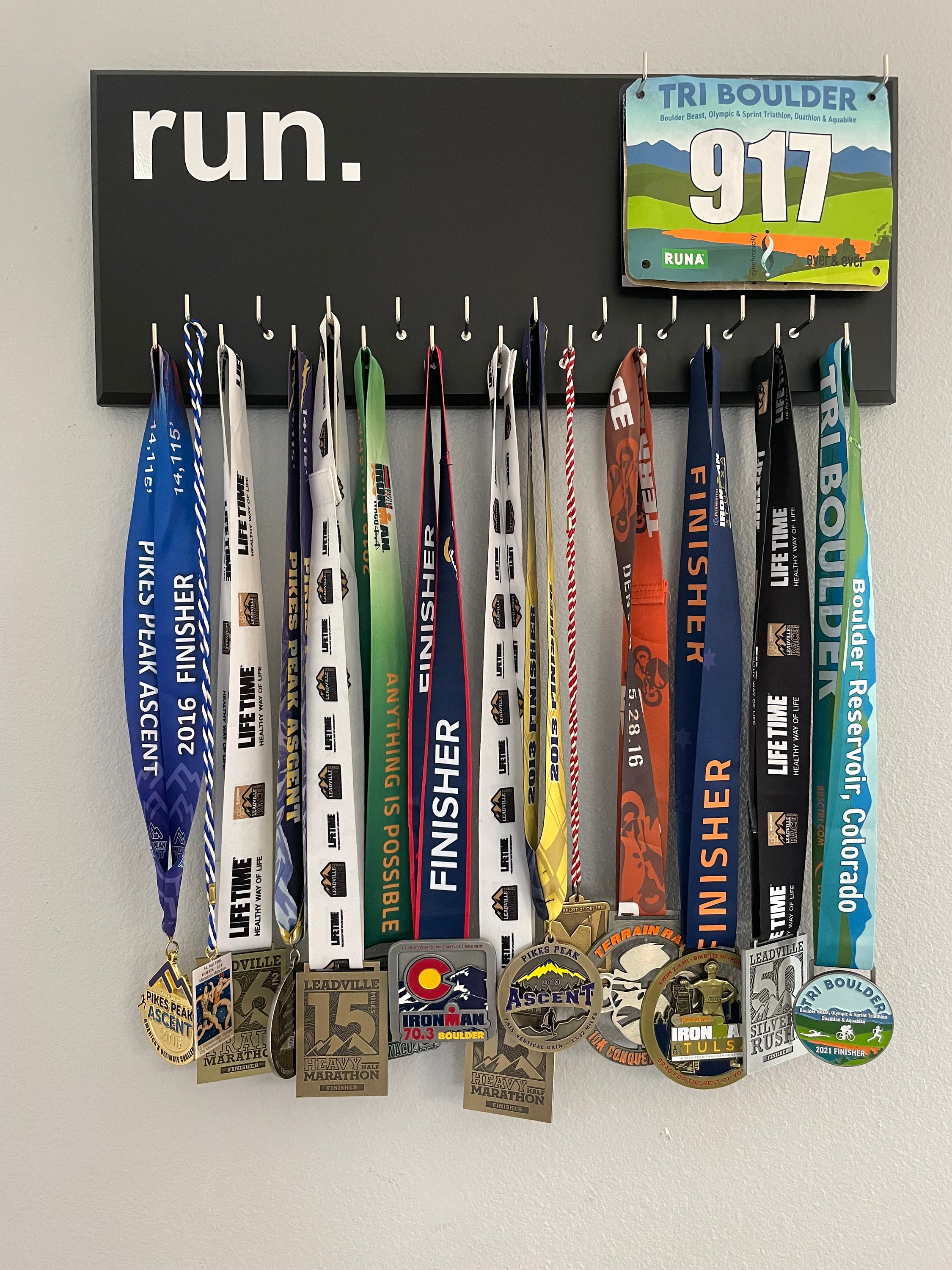 Running Medal Holder, gray or black with chrome "run." vinyl, 21 hooks and BIB holder