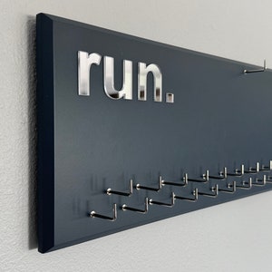 Running Medal Holder with 3D lettering, gray or black with 3D acrylic &quot;run.&quot; letters, 21 hooks and BIB holder
