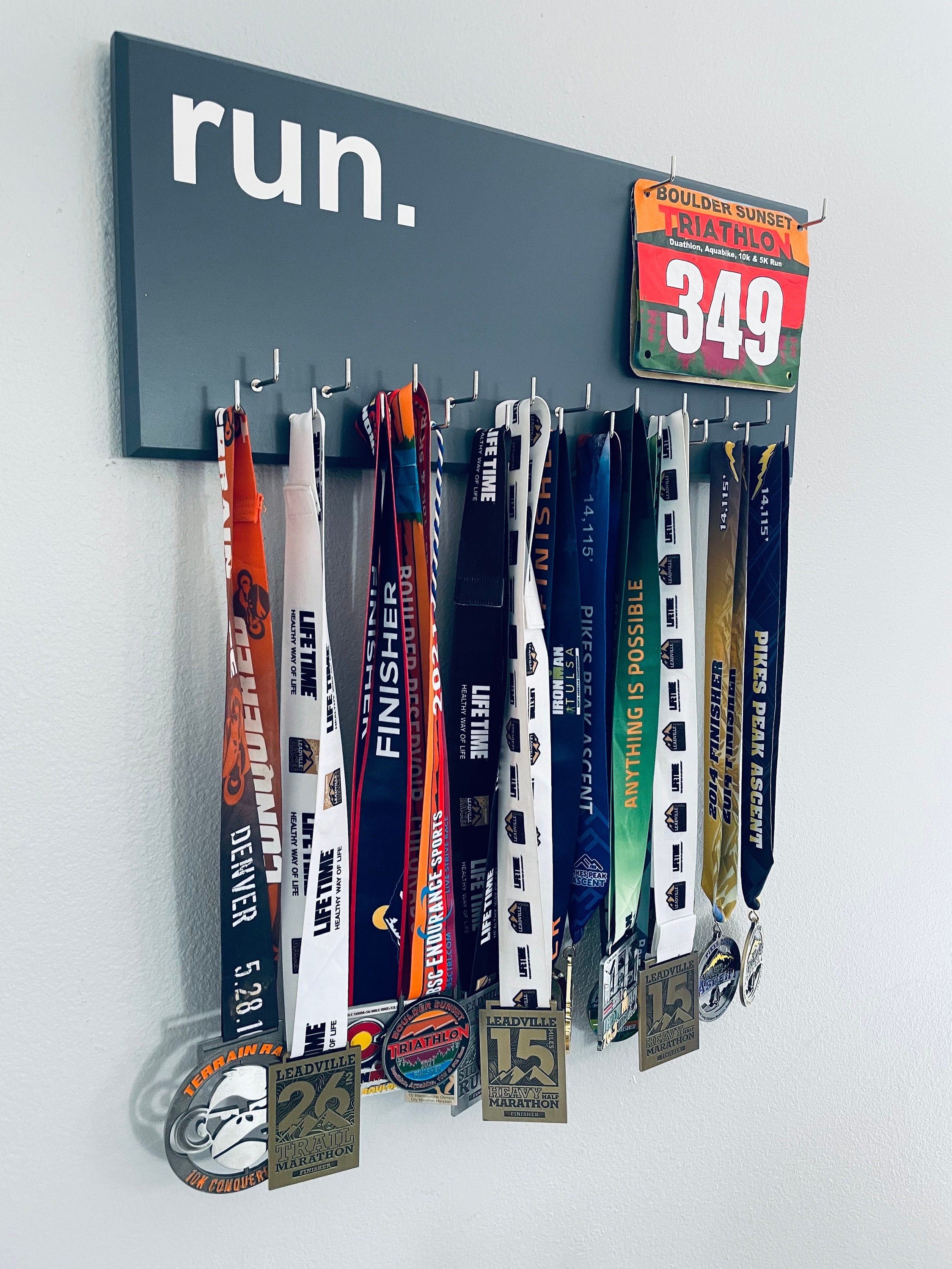 Running Medal Holder, gray or black with chrome "run." vinyl, 21 hooks and BIB holder