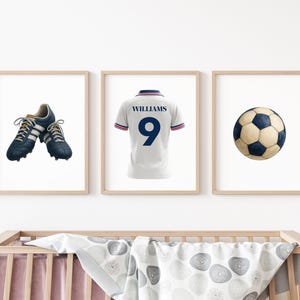 May include: Three framed prints with football-themed illustrations. One shows blue football boots with white stripes. Another displays a white football shirt with the number 9. The third print is of a classic football.
