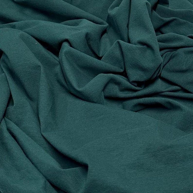 Tecido de malha jersey de algodão e elastano ultra macio com elasticidade em 4 direções, vendido por metro, 200 g/m², para body modelador. Cor natural. Hunter