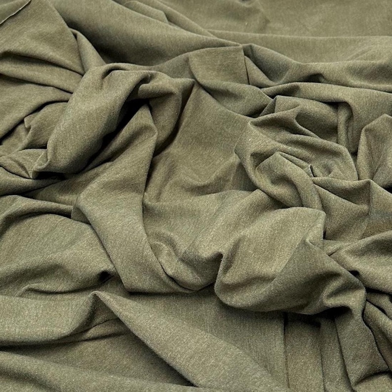 Tecido de malha jersey de algodão e elastano ultra macio com elasticidade em 4 direções, vendido por metro, 200 g/m², para body modelador. Cor natural. Olive