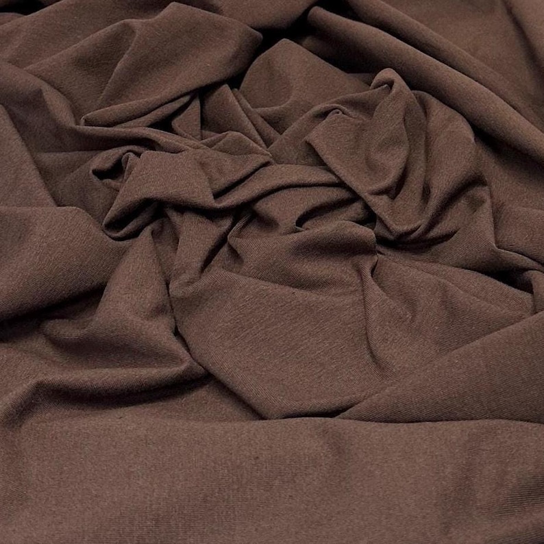 Tecido de malha jersey de algodão e elastano ultra macio com elasticidade em 4 direções, vendido por metro, 200 g/m², para body modelador. Cor natural. Brown