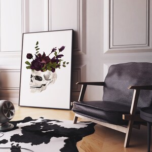 May include: A black and white skull with a crown of dark purple flowers on a white background.
