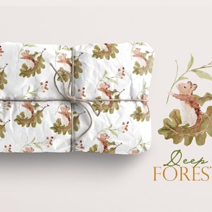 May include: A white wrapping paper with a repeating pattern of brown mice on green leaves and red berries. The text "Deep Forest" is written in brown cursive lettering on a white background.