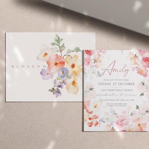 May include: Two floral themed invitations. The first invitation has the word "BLOSSOM" printed in a light gray font. The second invitation has a watercolor floral design with the name "Amily" printed in a pink font. The text reads "Please join us for her christening, Sunday, 27 December, Saint Presbyterian Church, [address] at [time]."