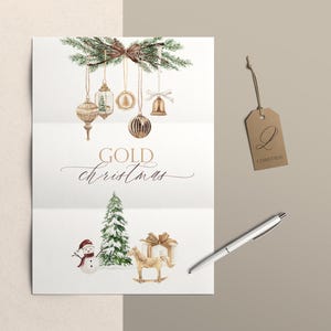 May include: A white card featuring watercolor illustrations of hanging gold ornaments, pine branches, a snowman, a snow-covered pine tree, a gift box, and a rocking horse. The text reads GOLD christmas. A brown tag with the letter Q and a silver pen.