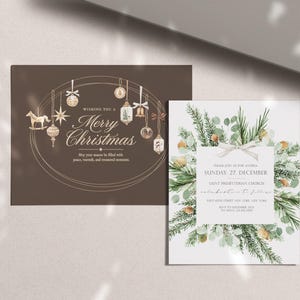May include: A brown rectangular Christmas card featuring hanging ornaments and the text Merry Christmas, alongside a white rectangular invitation card decorated with a watercolor wreath of pine branches and eucalyptus leaves with a central white bow.