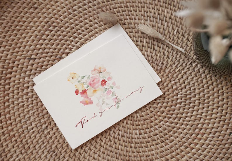 May include: A white card with a watercolor painting of pink, red, and yellow flowers. The card says "Thank you for coming" in red cursive.