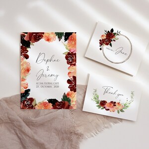 May include: Three cards with watercolor floral wreaths. The top card says "Daphne & Jeremy" with the date "23. October. 2020" and the text "At The Floral Cafe". The middle card says "Table No. 1 Jane". The bottom card says "Thank you".
