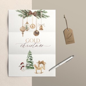 May include: A white card featuring watercolor illustrations of hanging gold ornaments, pine branches, a snowman, a snow-covered pine tree, a gift box, and a rocking horse. The text reads GOLD christmas. A brown tag with the letter Q and a silver pen.