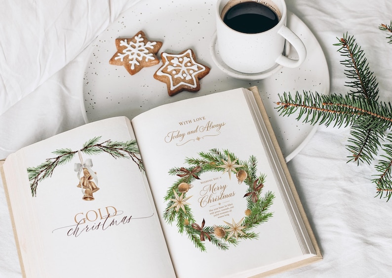 May include: An open book with Christmas illustrations featuring gold bells and a wreath, accompanied by two star-shaped cookies with white icing and a white mug of black coffee on a speckled plate, with a green pine branch nearby.
