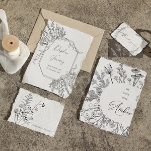 May include: A set of wedding stationery with a botanical theme. The cards feature hand-drawn floral illustrations and the text "Daphne & Jeremy" and "My Only Love Amber".