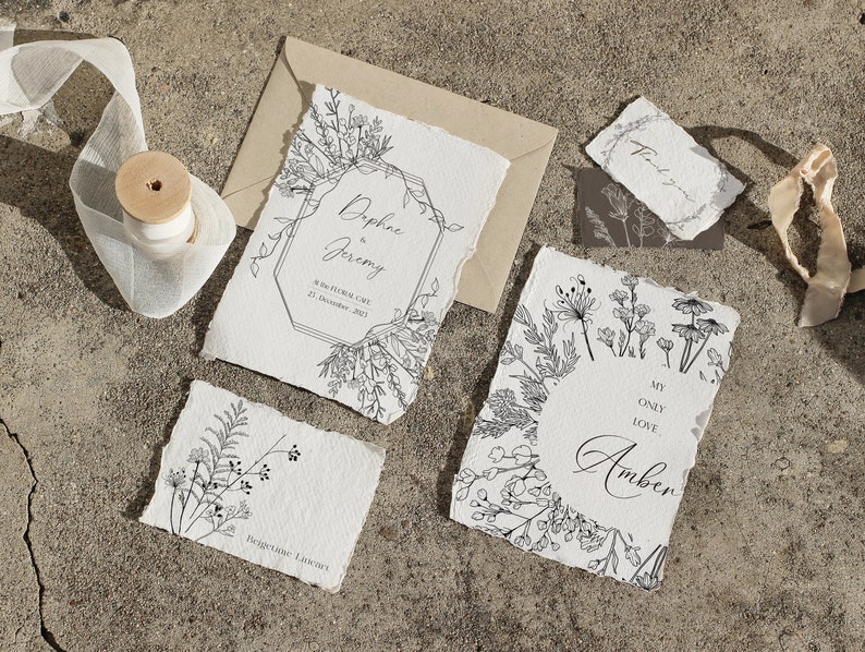 May include: A set of wedding stationery with a botanical theme. The cards feature hand-drawn floral illustrations and the text "Daphne & Jeremy" and "My Only Love Amber".
