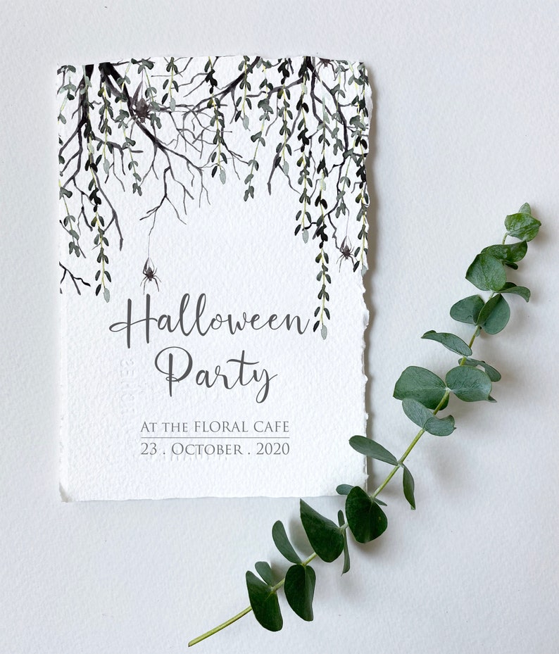 May include: A white card with a black and gray watercolor illustration of branches with leaves and spiders. The text "Halloween Party" is written in black cursive script. Below the text is "At the Floral Cafe" and "23. October. 2020".