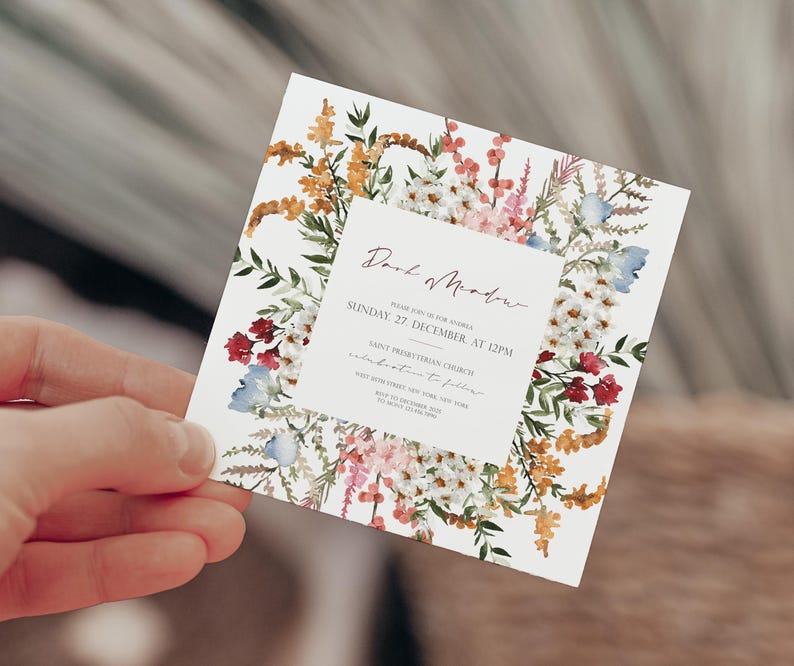 May include: A floral wedding invitation with a white background and a border of watercolor flowers in shades of pink, red, blue, and yellow. The text reads "Dear Mother, Please join us for Andrea & [unclear text] Sunday, 27 December at 12PM Saint Presbyterian Church Celebration to follow [unclear text] 27 December 20XX [unclear text] RSVP by 1 December 20XX [unclear text]