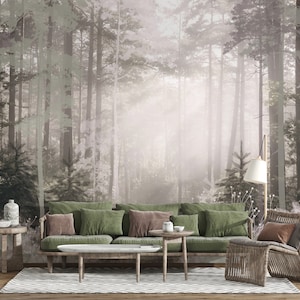Könnte beinhalten: Ein grünes Sofa mit braunen Kissen steht vor einer Wandmalerei, die eine neblige Waldszene darstellt. Das Sofa steht vor einem Holz-Couchtisch und einem Korbstuhl mit einem braunen Kissen.