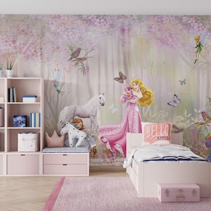May include: A pink and white bedroom with a mural featuring a princess, a unicorn, and birds. The mural is on the wall behind a white bed with a pink pillow that says "Hello Summer".