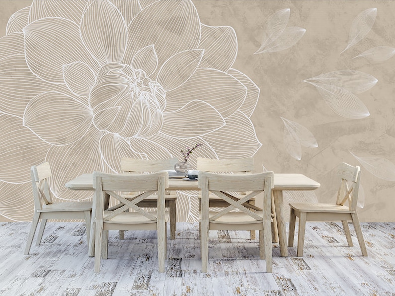May include: A beige dining room with a white floral wallpaper featuring a large flower and smaller leaves. The room has a wooden table with four chairs.
