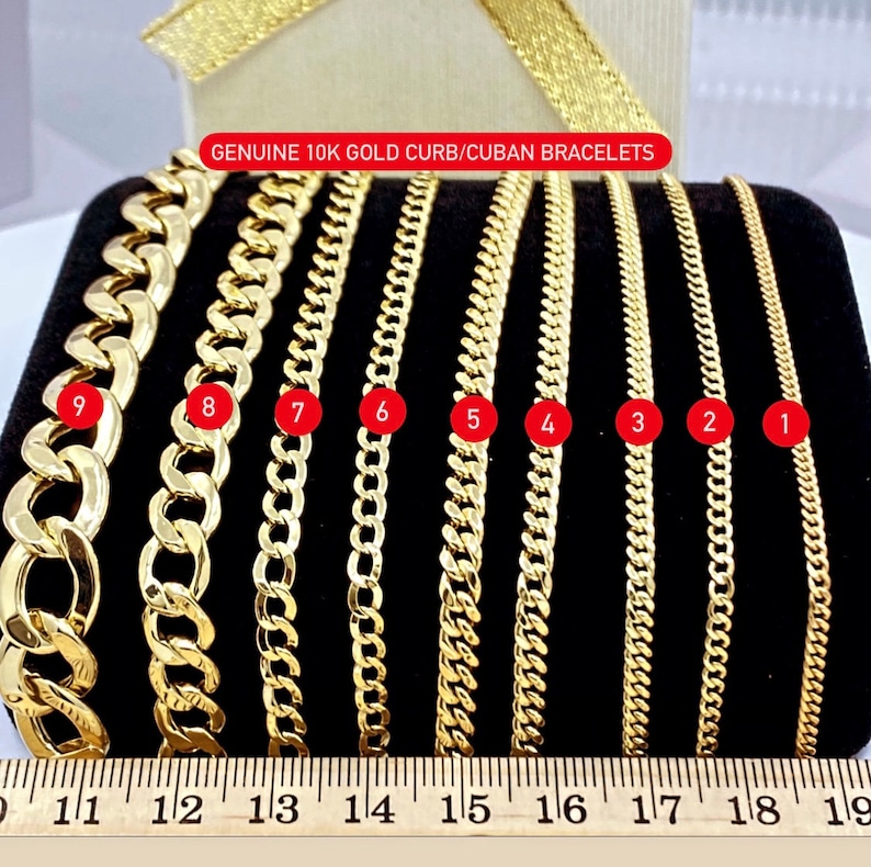 May include: Nine 10k gold curb or Cuban bracelets laid out in a row on a black surface, with a ruler underneath. The bracelets are numbered 1 through 9, with the largest bracelet being number 9 and the smallest being number 1.