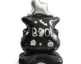 May include: Black and silver Halloween cauldron balloon with a silver flame on top. The cauldron has a ghost, stars, a bat, a crescent moon, and a pumpkin on it. The text "BOO!" is printed on the front.