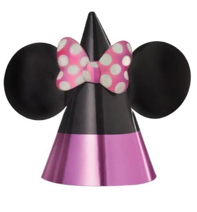 Puede incluir: Un gorro de fiesta negro y rosa con orejas de Minnie Mouse y un lazo rosa con lunares blancos. El gorro est&aacute; hecho de papel brillante.