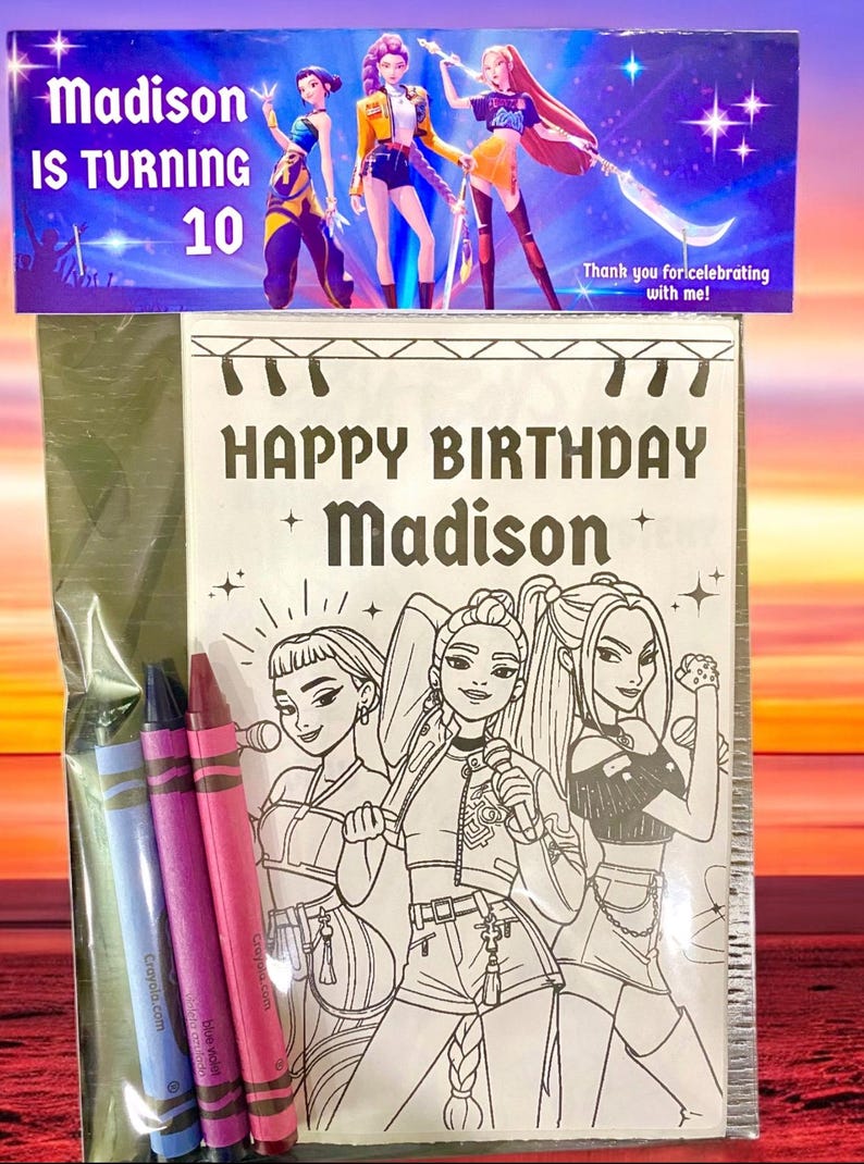 May include: A birthday-themed coloring book set with crayons. The cover reads "HAPPY BIRTHDAY Madison" and features illustrations of three animated characters. The top banner says "Madison IS TURNING 10". Includes blue, purple, and pink crayons.