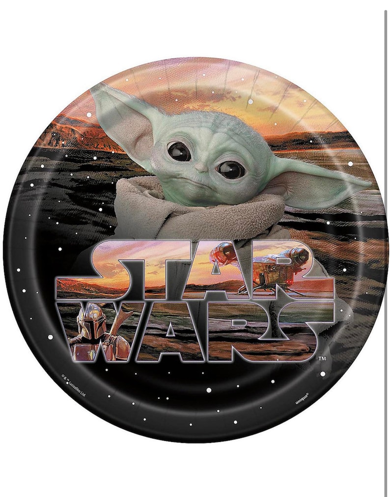 May include: A round paper plate with a black background and a white "Star Wars" logo. The logo is layered with images of characters from the Star Wars franchise, including a Mandalorian and a Baby Yoda. The background is a sunset scene with stars.