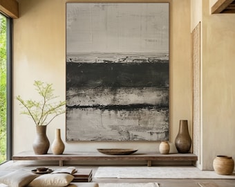 May include: Abstract painting with horizontal bands of white, black, and gray paint. The painting is displayed on a wall in a modern interior with a wooden ceiling and a wooden shelf.