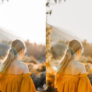 May include: A woman with long blonde hair wearing a yellow off-the-shoulder top stands in a field with a blurred background of hills and trees.