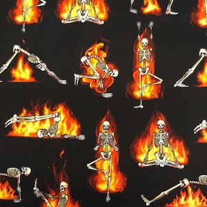 May include: A black fabric with a repeating pattern of skeletons in various yoga poses, surrounded by flames. The skeletons are white and the flames are orange and yellow.