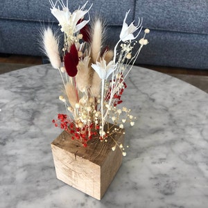 solid wood square vase and its fresh flowers stabilized