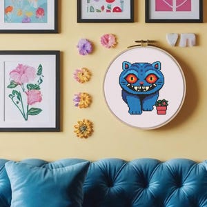 kpop demon hunters derpy the tiger cross stitch pattern pdf silly billy cross embroidery fan art file funny quirky tiger character hoop art colourful geeky stitch design digital download embroidery chart with dmc floss list and skein guidance includes colour and black and white charts perfect for kpop stans who love movie characters huntrix and saja boys cosplay fans anime nerdy collectors and handmade gift embroidery