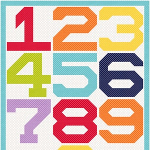 May include: A rectangular wall art print featuring the numbers zero through nine arranged in a grid. Each number is rendered in a bold, block-style font with a white polka dot pattern against a solid background of red, orange, yellow, lime, blue, or purple.