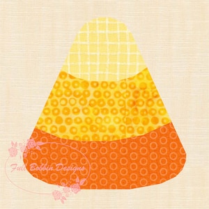 May include: A colorful candy corn design with three distinct sections: yellow, orange, and a lighter yellow. The top section has a grid pattern, the middle has a circle pattern, and the bottom has a circle pattern. The design is on a cream background.