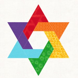 May include: A six-pointed star shape composed of six individual triangles arranged in a circular pattern. Each triangle features a distinct color including red, orange, yellow, green, light blue, and purple, with subtle patterned textures on each.