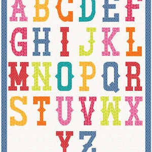 May include: A colorful alphabet quilt featuring letters A through Z in various colors, including pink, orange, green, and blue. The letters are set against a white background with a blue patterned border. The quilt is a patchwork design.