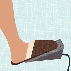 May include: A brown foot pedal with a white stripe and a gray base. The pedal is connected to a cord.