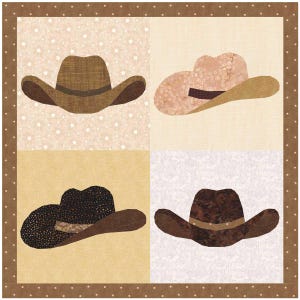 May include: A patchwork quilt square showing four cowboy hats in shades of brown, tan, and beige. Each hat has a different pattern and texture, set against a background of complementary colours and patterns. The quilt is framed with a dotted border.