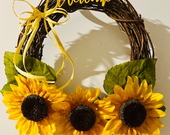 A Sunflower Wreath! Whether on your front door or as an accent piece inside your home, this spring wreath will ring beauty to to your space.