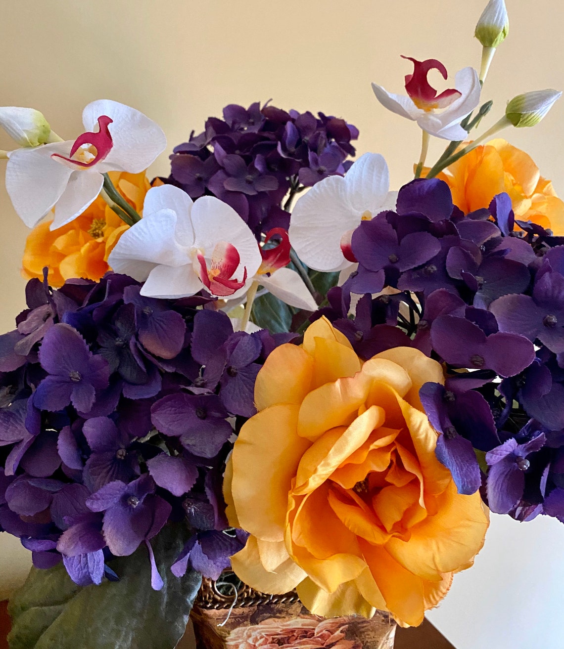 A silk flower arrangement in gemstone colors Purple and Gold. Etsy