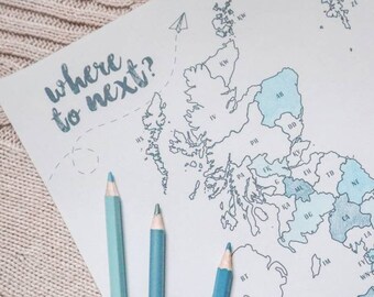 May include: A map of the United Kingdom with the counties outlined in black and filled in with light blue watercolor. The words "where to next?" are written in the top left corner of the map.