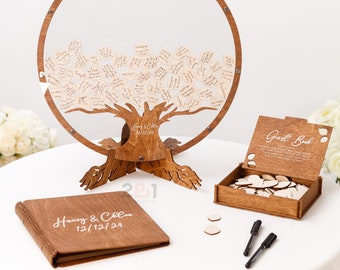 May include: A wooden guest book set with a tree design. The tree is made of wood and has a clear acrylic circle around it. The set includes a wooden box with heart-shaped pieces of wood for guests to write on, two black pens, and a wooden guest book with the text "Henry & Chloe 12/12/24".
