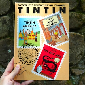 The Adventures of Tintin 3 Complete Adventures in 1 Volume Tin Tin in America, Cigars of the Pharaoh, and The Blue Lotus