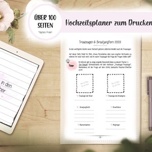 May include: A digital wedding planner with over 100 pages, featuring a tablet with the text "Blick in den Ordner" and a page with the text "Hochzeitsplaner zum Drucken". A pen and a smartphone are also visible.