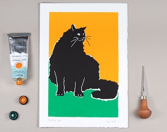May include: A black and white print of a fluffy cat sitting on a green and yellow background. The print is titled "Fluffy Cat" and dated "Sep 2021".