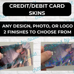 May include: Two credit card skins with a photo of two dogs cuddling. The skins are available in two finishes: a glossy finish and a glittery finish.